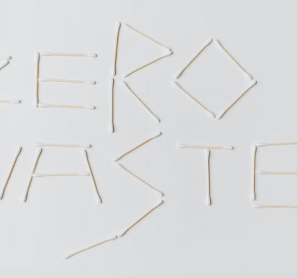 Creative layout of zero waste sign formed with cotton swabs on a white background.