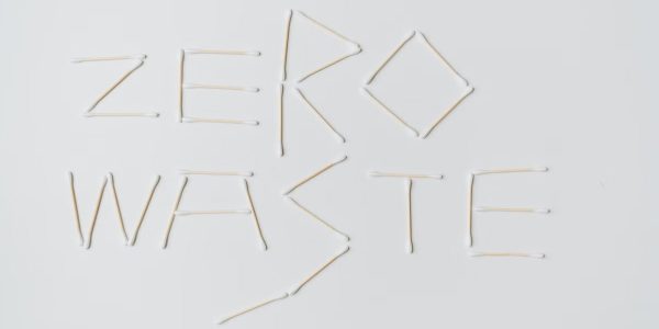 Creative layout of zero waste sign formed with cotton swabs on a white background.